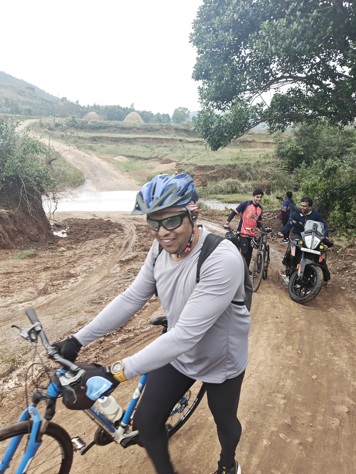 Cyclist pausing at a stream crossing